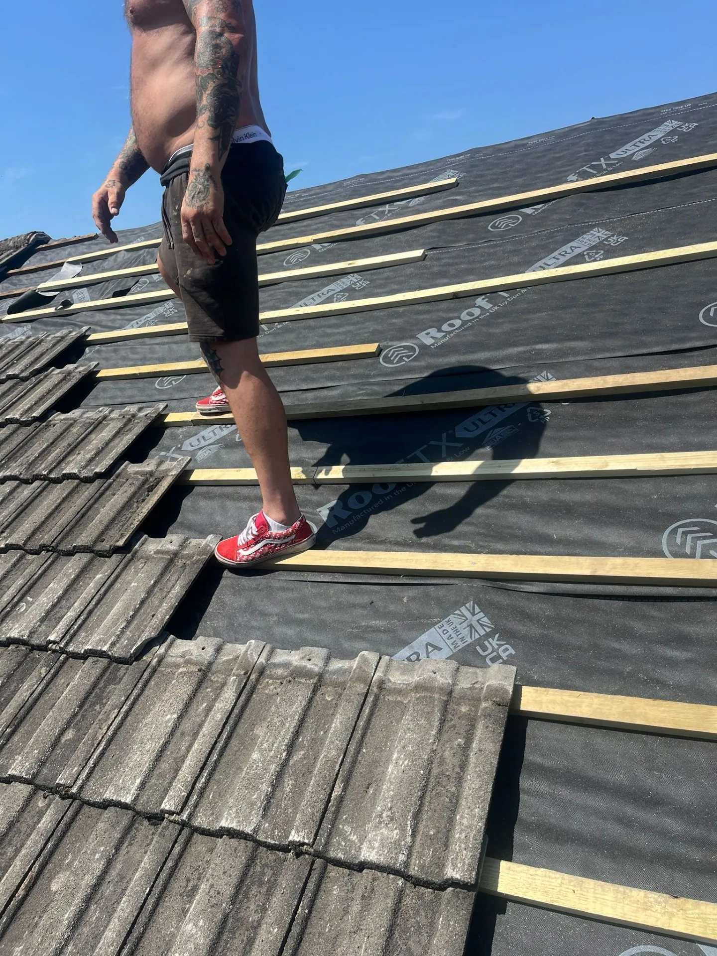 New membrane and battens being installed