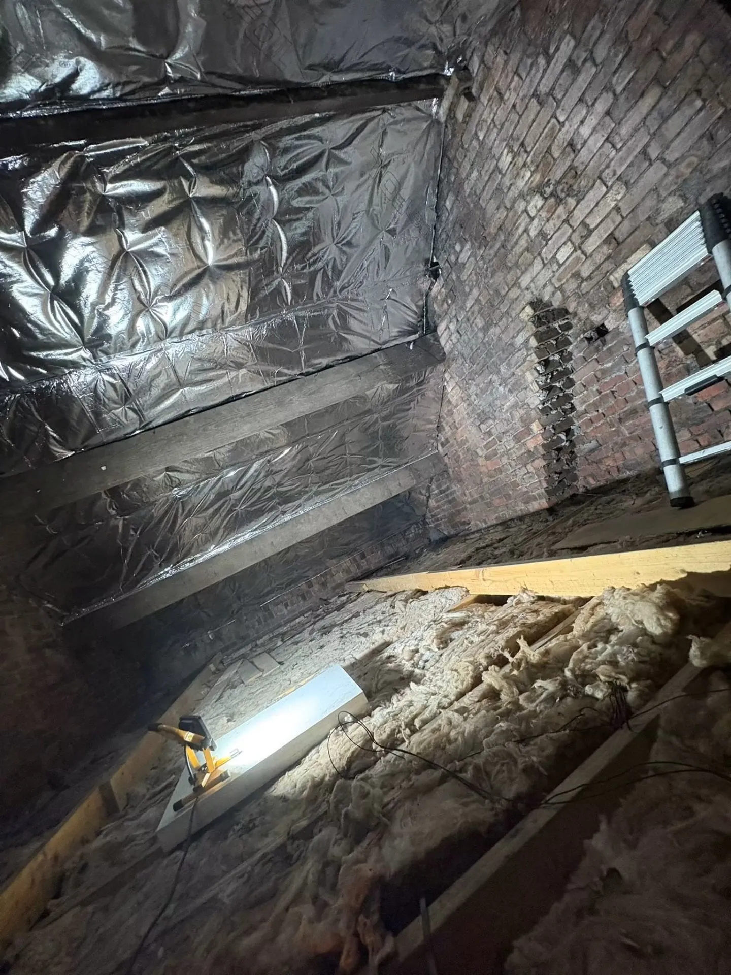 Superfoil being installed to rafters